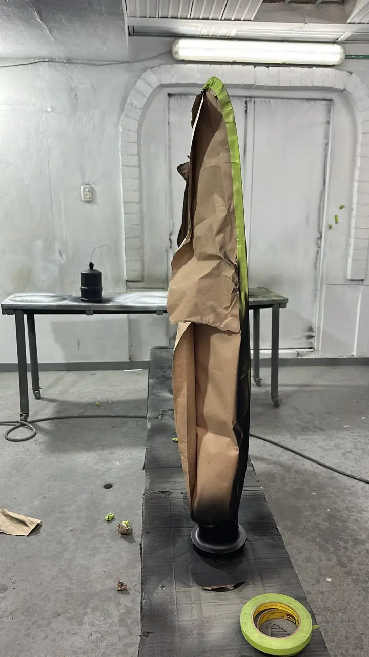 Propeller blade masked in the paint booth for surface treatment
